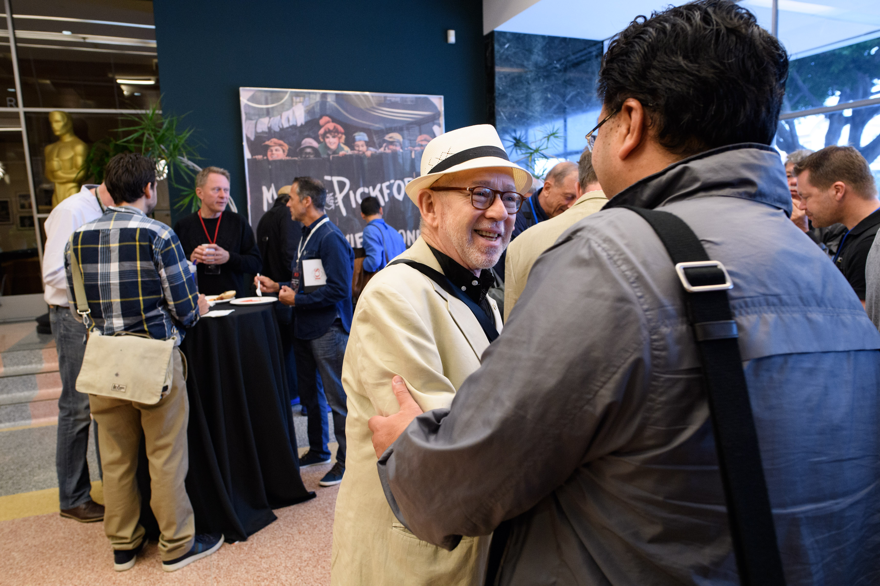 Steven B. Poster, ASC — president of IATSE Local 600, the International Cinematographers Guild — greets a fellow ICS attendee at the Pickford Center. Photo courtesy of the Academy of Motion Picture Arts and Sciences