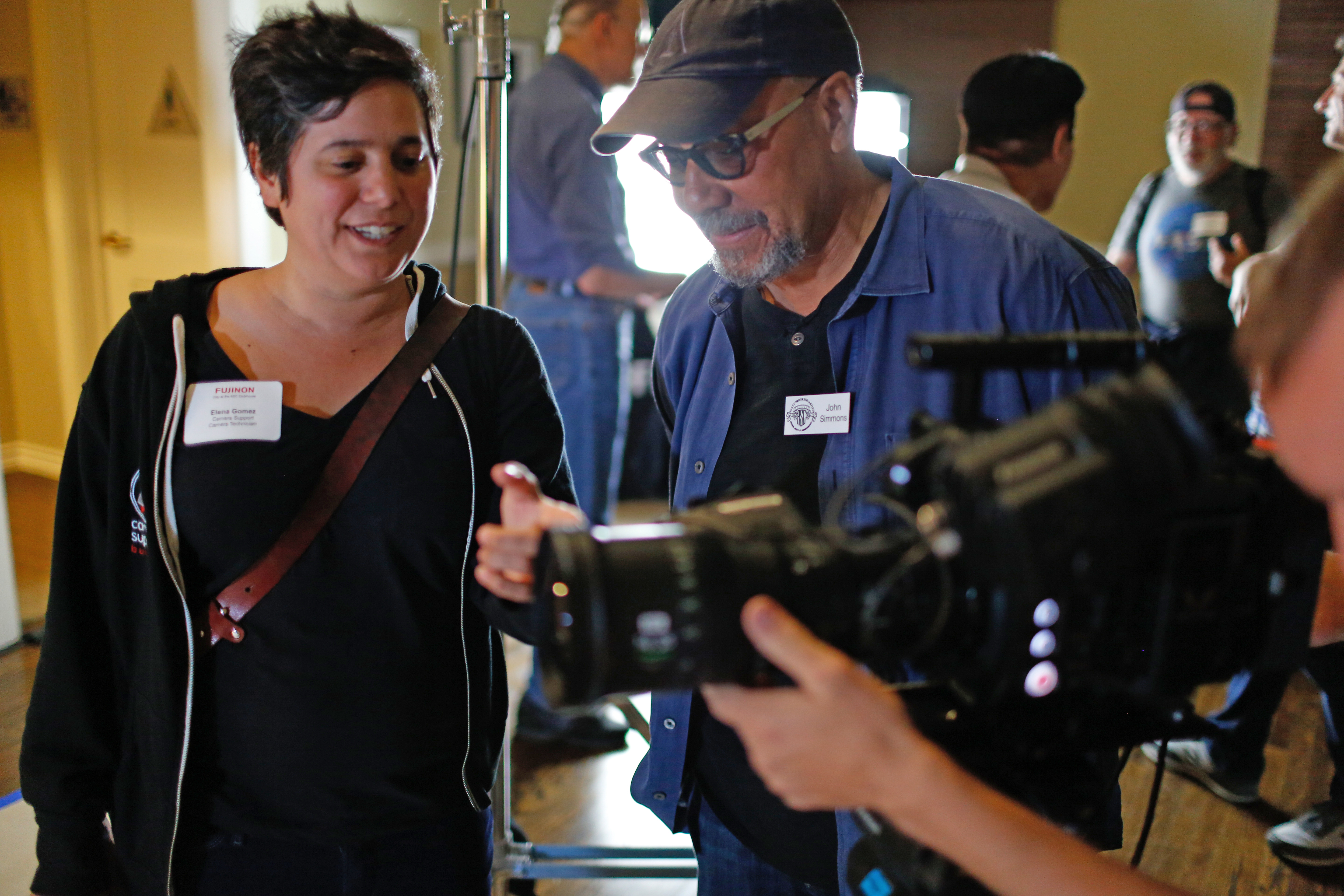 Camera technician Elena Gomez confers with John Simmons, ASC.
