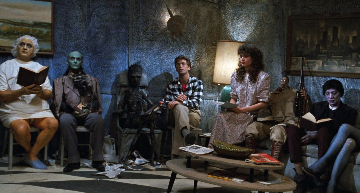 Barbara and Adam in the afterlife waiting room — surrounded by a few of the film’s other colorful characters.