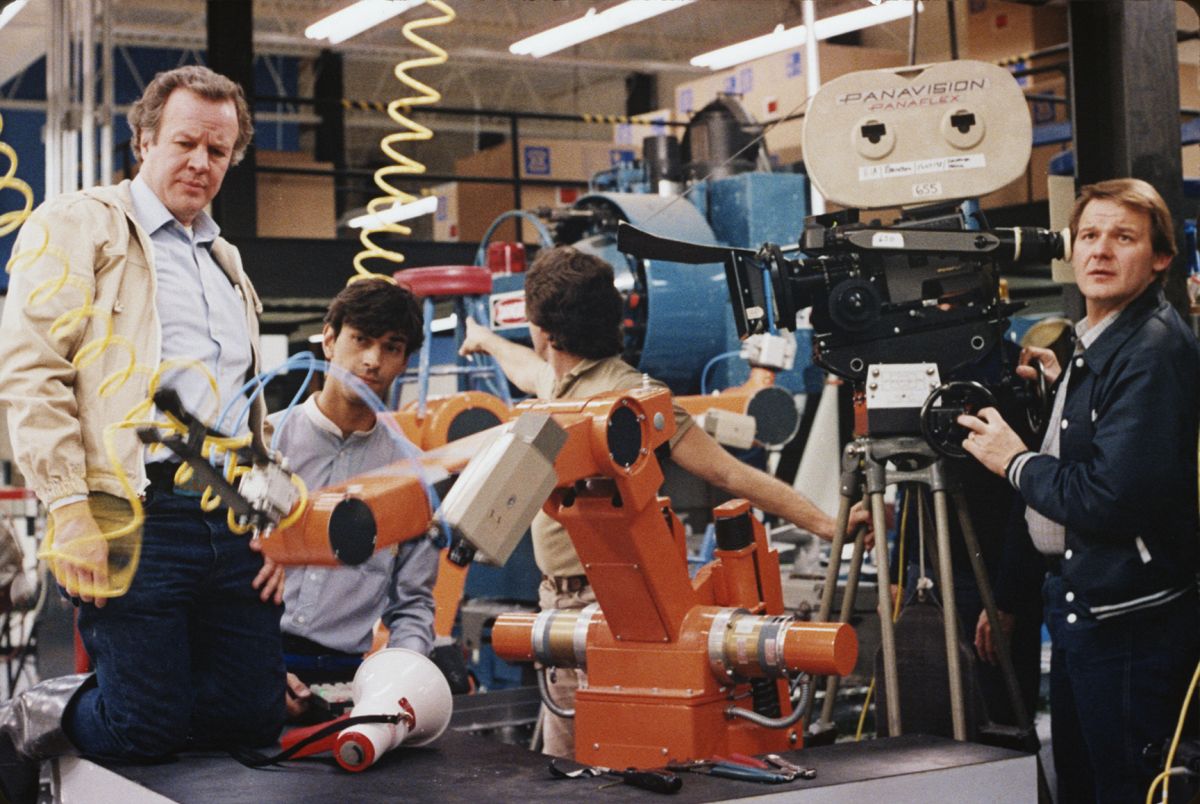 Douglas Trumbull (left), props and miniatures technician Leslie Ekker, action props and miniatures supervisor Mark Stetson, and Richard Yuricich, ASC on the set of Brainstorm. (Image courtesy the Academy of Motion Picture Arts and Sciences)