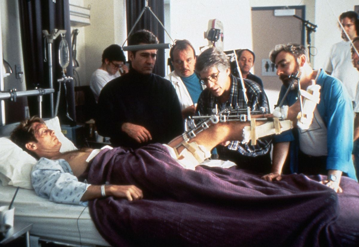 Cronenberg tends to Spader's compound leg "injury" while Suschitzky observes from behind his Panaflex. On an intimate production such as Crash, the cameraman prefers to do his own operating, noting, “I feel closer to the movie if I'm looking through the camera, as if I am the first audience to see the film."