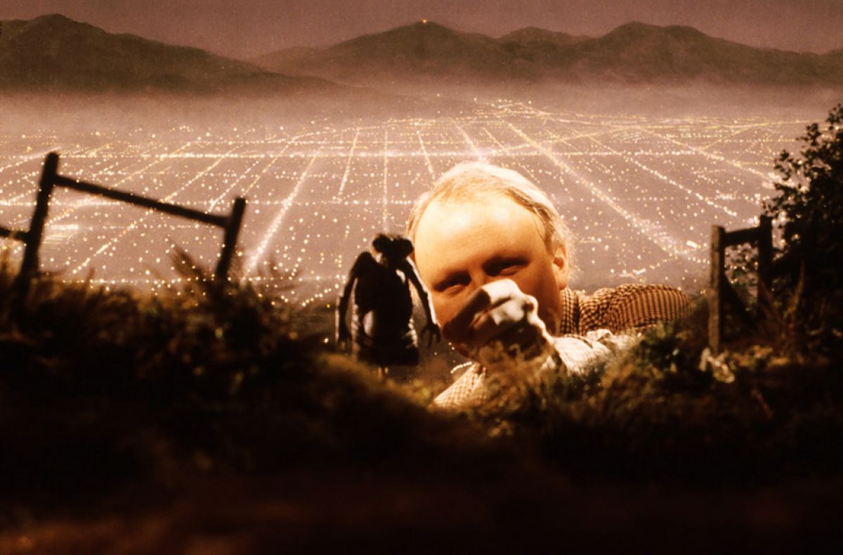 Dennis Muren, ASC preps a shot of E.T. on a forced-perspective miniature set.