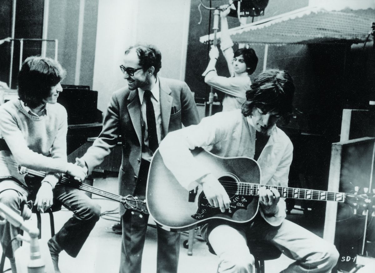 While shooting The Rolling Stones: Sympathy for the Devil (aka One Plus One, 1968), Richmond adjusts a fixture as Mick Jagger strums a chord and director Jean-Luc Godard greets bassist Bill Wyman. (Photo courtesy of Pictorial Press Ltd / Alamy Stock Photo)