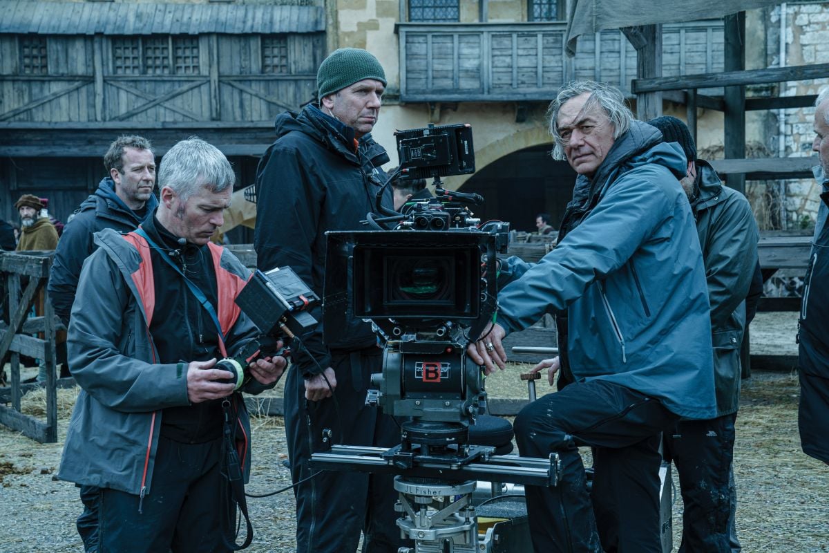 Cinematographer Dariusz Wolski, ASC (right) frames a shot during production of the medieval drama.