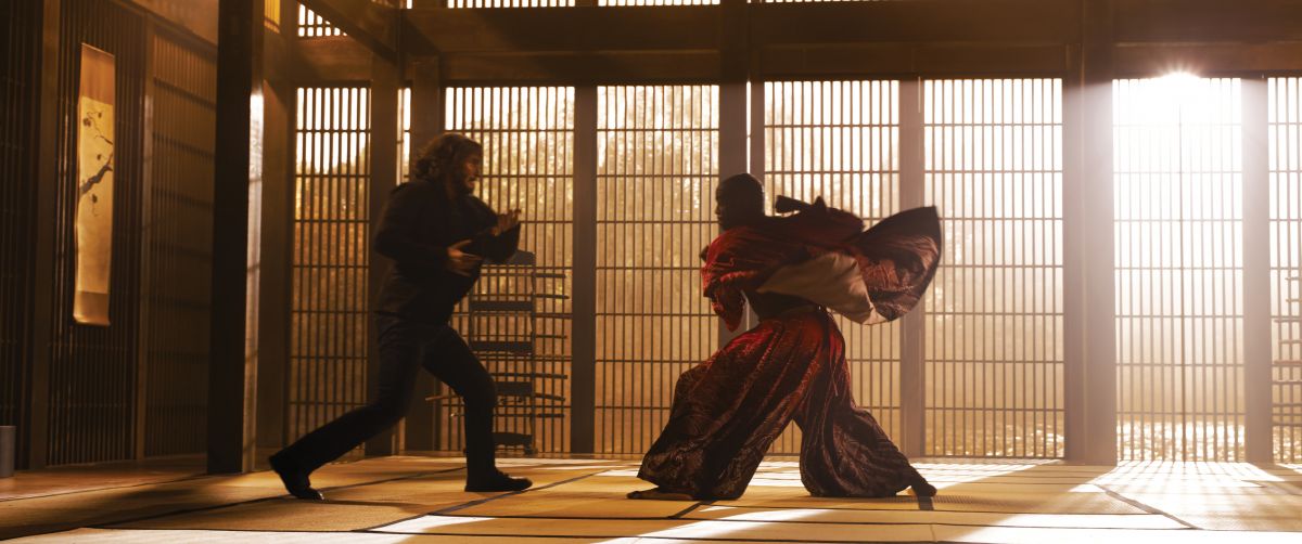 Neo and a reimagined Morpheus (Yahya Abdul-Mateen II) face off in a dojo.