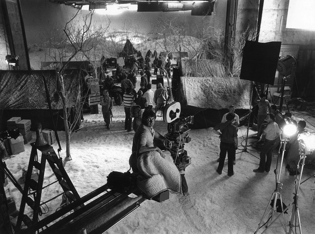 Tosi preps for a crane shot while filming a winter ambush scene on stage. The cinematographer often preferred to work on stage as it gave him total control over the lighting.