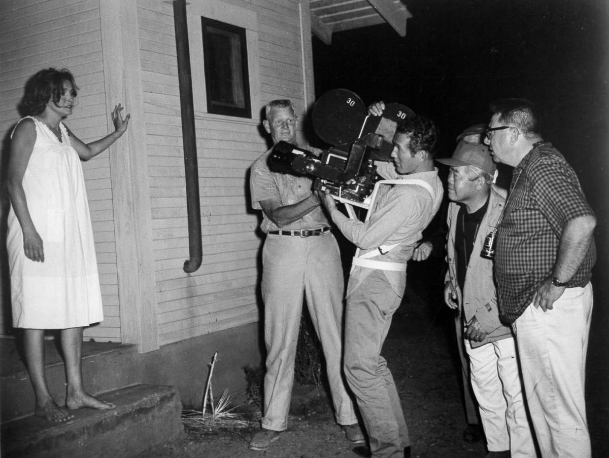 Hefting a Mitchell NC camera with a Panavision lens, Paul Newman tries to frame up on co-star Patricia Neal as he briefly takes a turn as James Wong Howe, ASC’s camera operator while shooting the Texas-set drama Hud (1963). That’s Howe directly behind the actor (in cap), and director Martin Ritt behind him. 