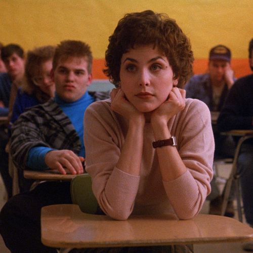 Audrey Horne (Sherilyn Fenn), one of Laura’s classmates, awaits some news.